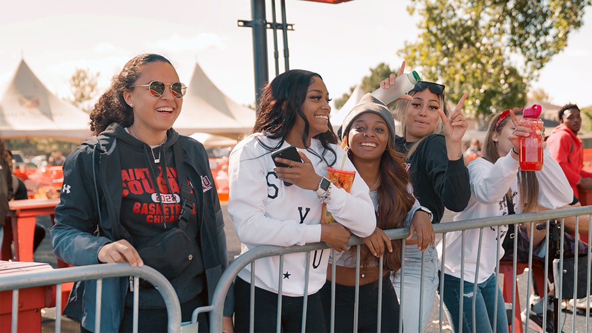 Group of SXU students smiling for picture at Homecoming