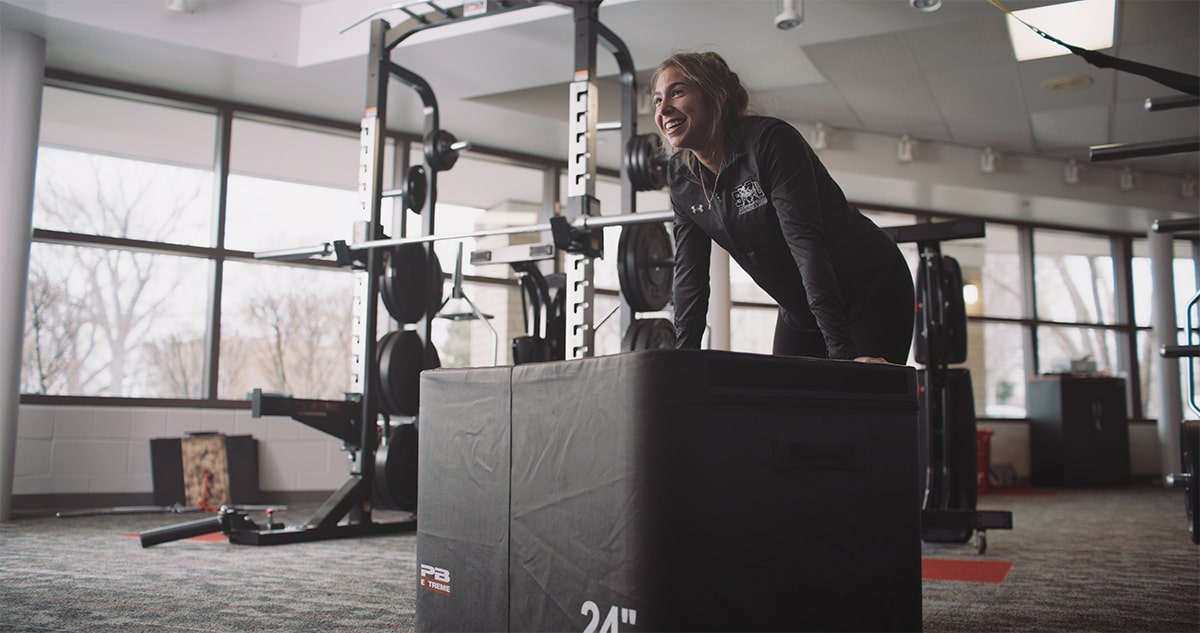 Client next to box jump for workout